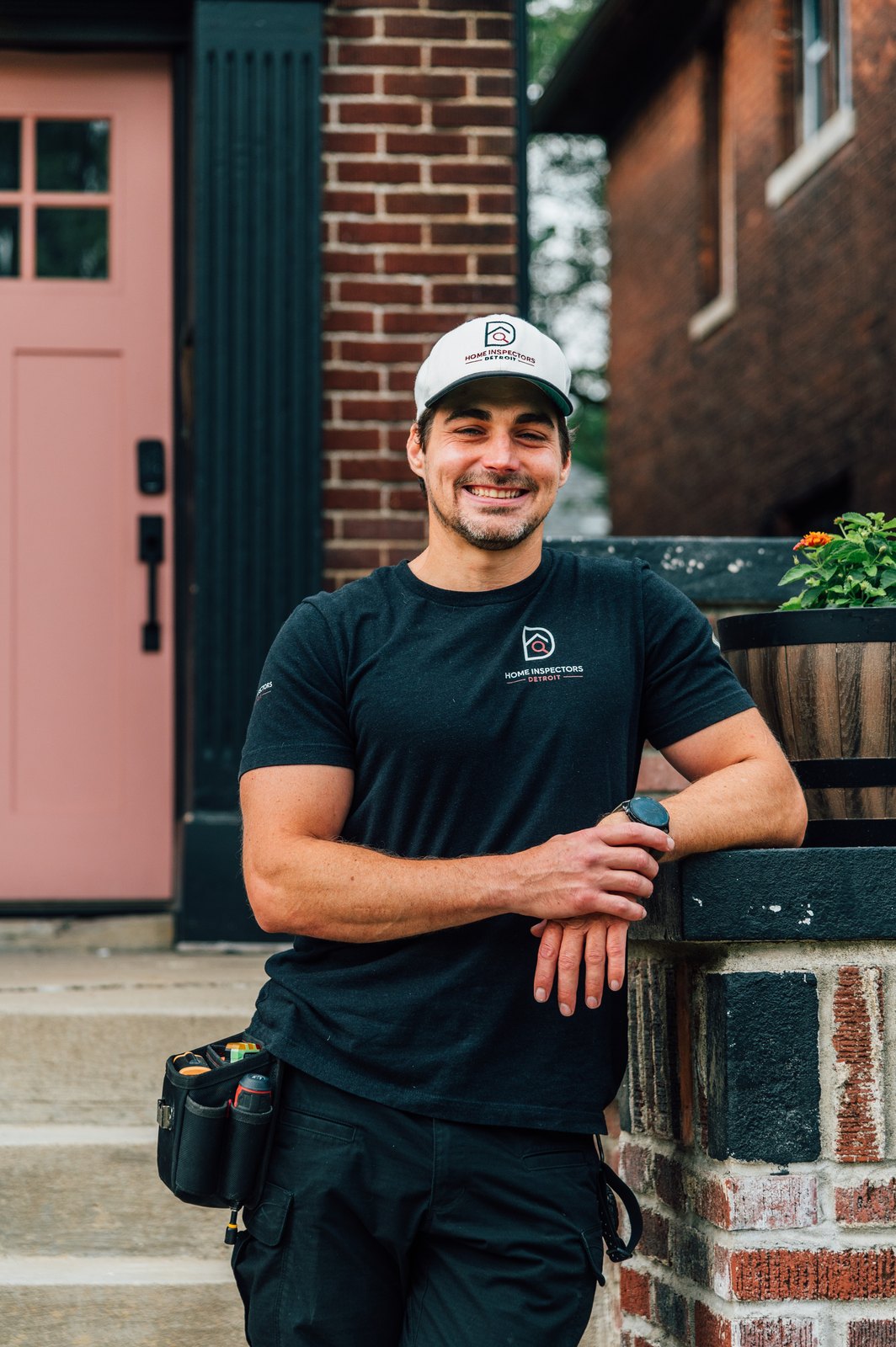 Milo Birk standing on a Detroit porch in Home Inspectors Detroit inspector gear